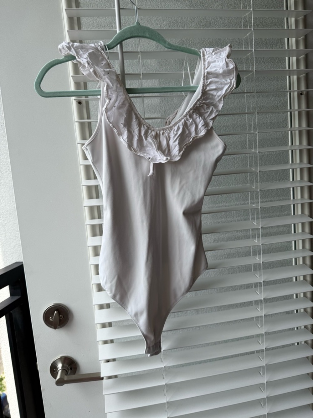 Women’s White Ruffled One-Piece Bodysuit